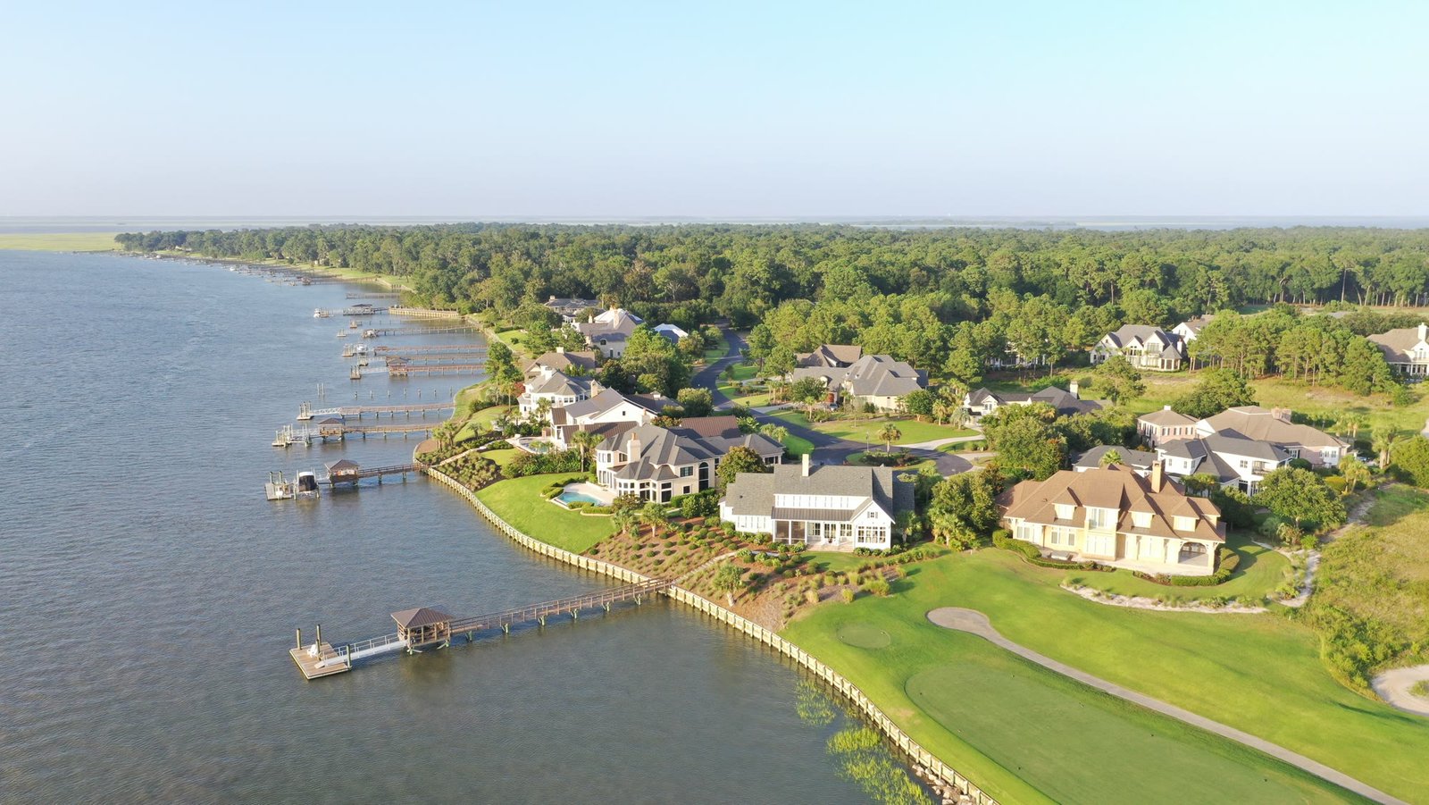 Coastal homes, docks, and a golf green on the water in Bluffton, South Carolina
